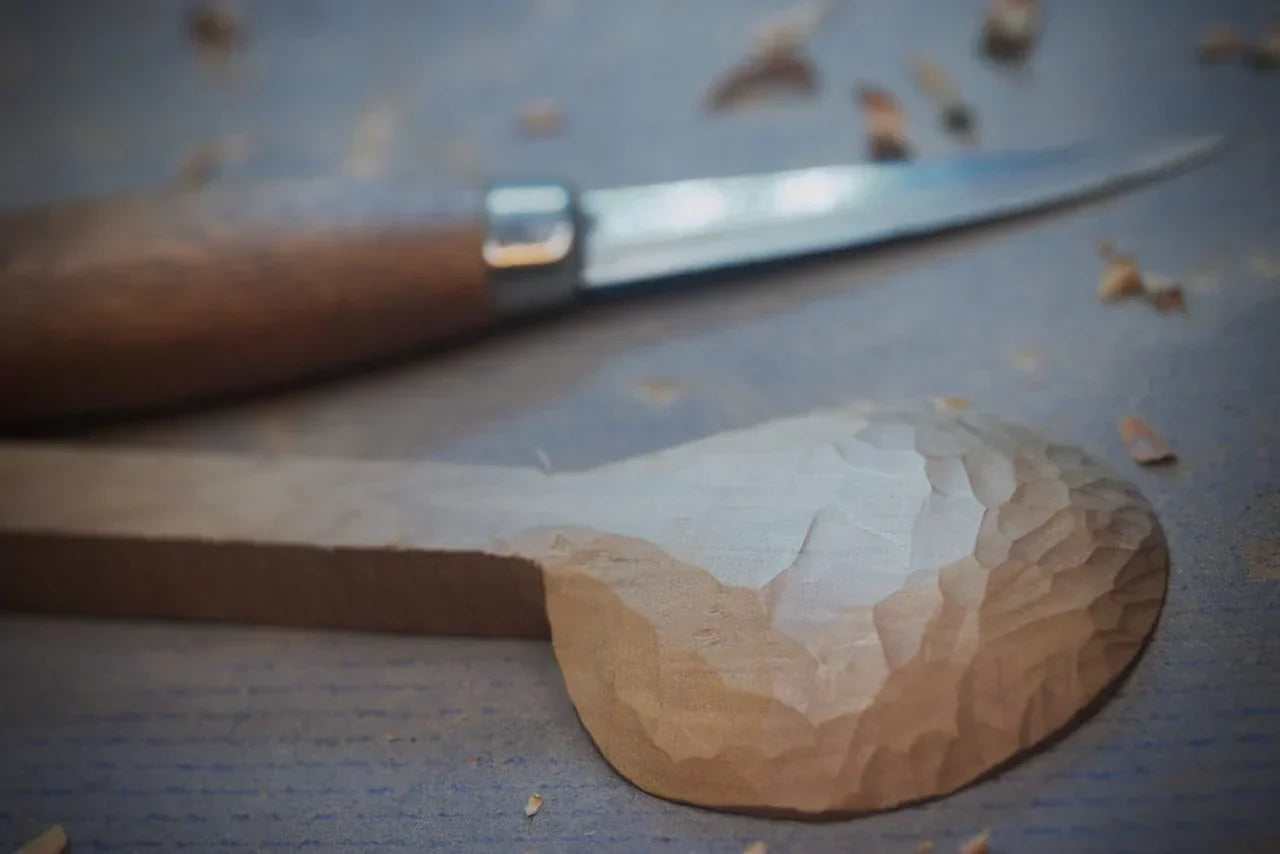 Wooden spoon with carving knife